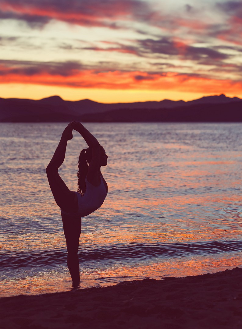 Yoga position at sunset<br />
More at <a rel=