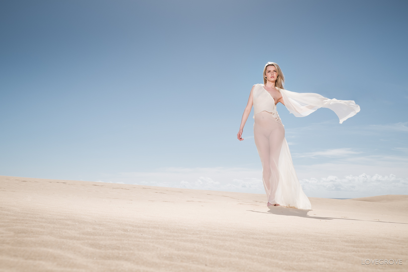 Carla Monaco on the sand dunes of Fuerteventura in a silk chiffon dress designed and comissioned by Damien Lovegrove and made by Lisa Keating