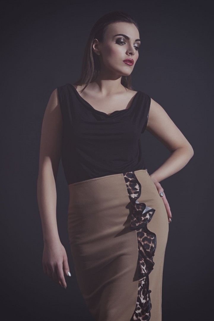 Black drape front top worn with the leopard ruffle pencil skirt in camel